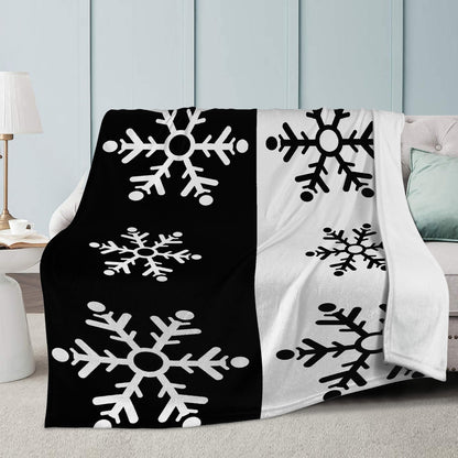 Reversible Snowflake Fleece Blanket with Dual-Sided Stitching.