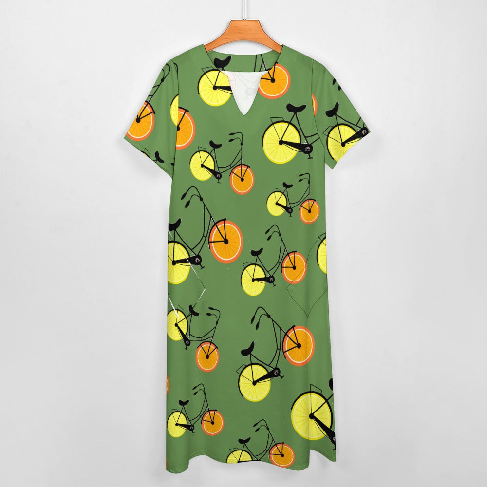 7-point sleeve dress Green with orange and lemon bicycles